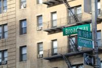 Street Signs on an interesction read "Broadway" and "W 169th" or "Coogan's Way"